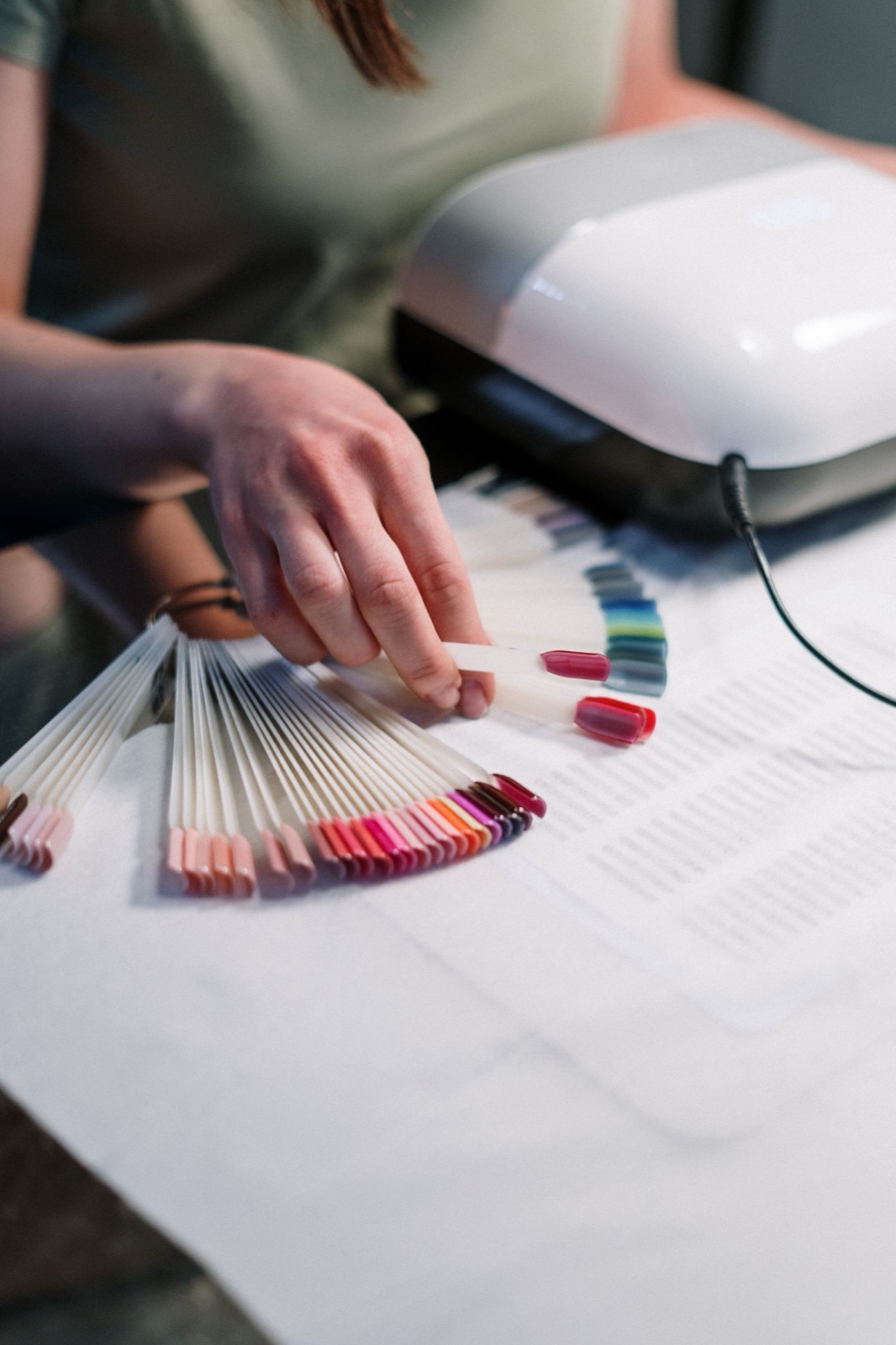 Custom press-on nail samples in a range of shapes and finishes