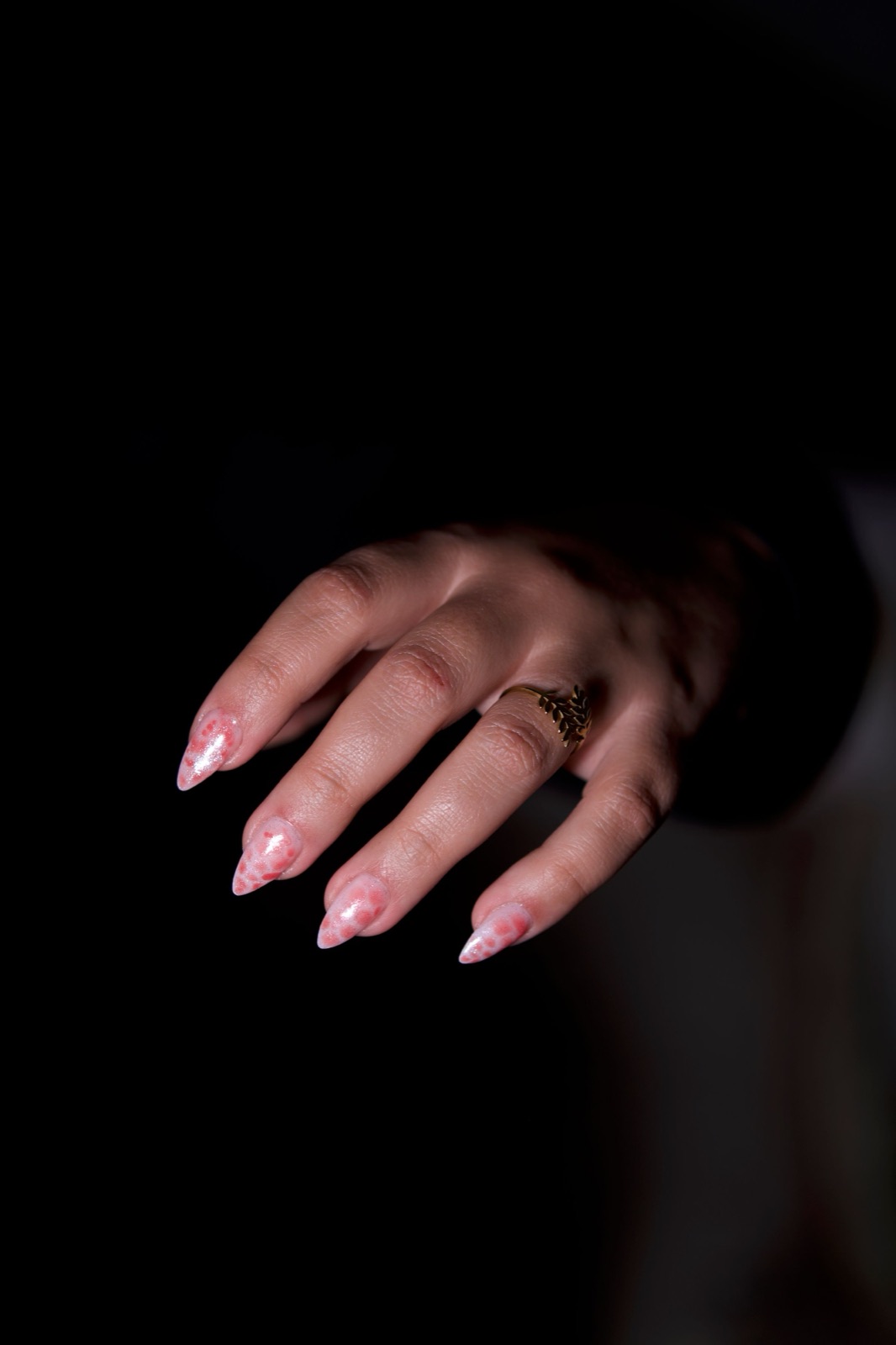 Almond shaped nails with a soft pink and white marble gel design