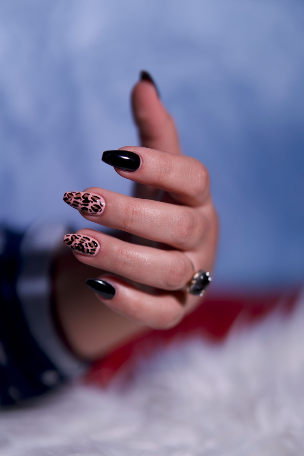 Close up of a leopard print manicure with glossy gel top coat