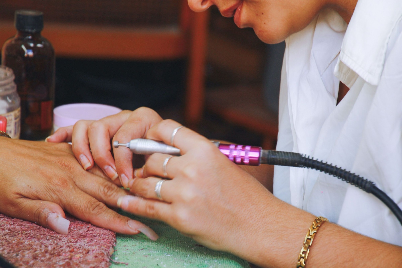 Clean sanitized nail tools and an e-file laid out at a Berkeley nail studio workstation